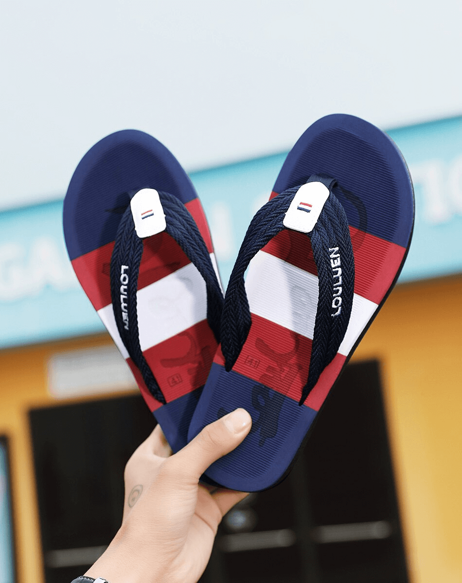 Fashionable breathable beach flip flops for men, featuring a red, white, and blue design with supportive straps and a durable sole.